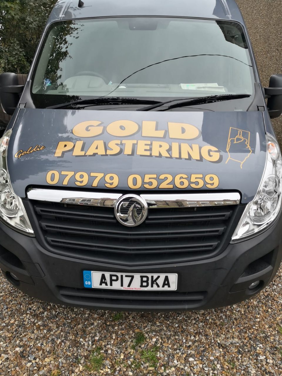 Front of the Gold Plastering van with business branding and phone number.