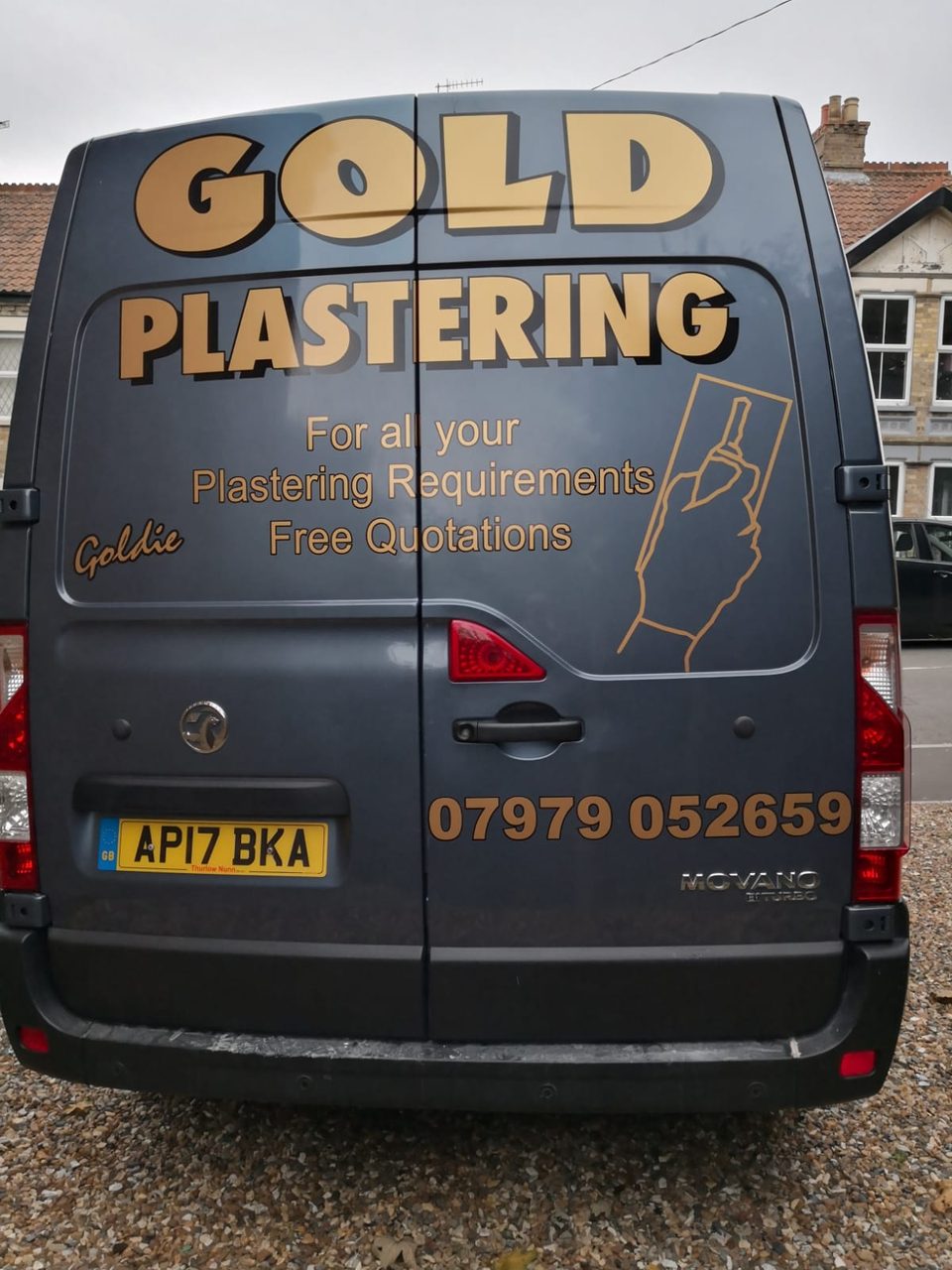 Rear doors of the Gold Plastering van with business branding and phone number.